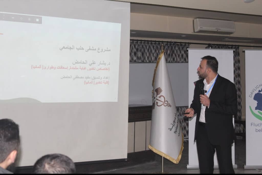 Ein Experte präsentiert medizinische Schulungsinhalte vor einer Leinwand während des Workshops organisiert von Daylight for All.